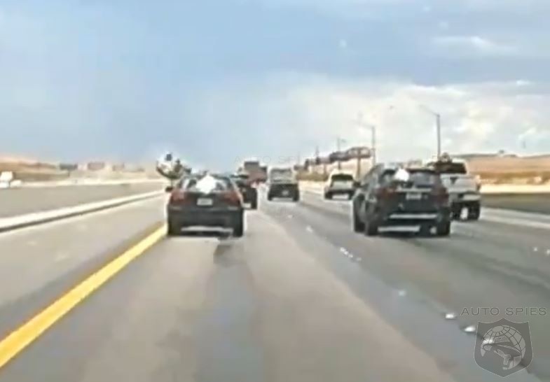 WATCH: Toyota Highlander Practices For The Olympics With A Tuck And Roll Across The Freeway